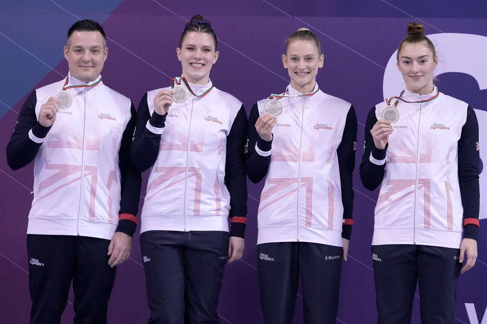 From left, coach Gary Short with Louise Brownsey, Bryony Page and Izzy Songhurst. Picture: British Gymnastics/Simone Ferraro