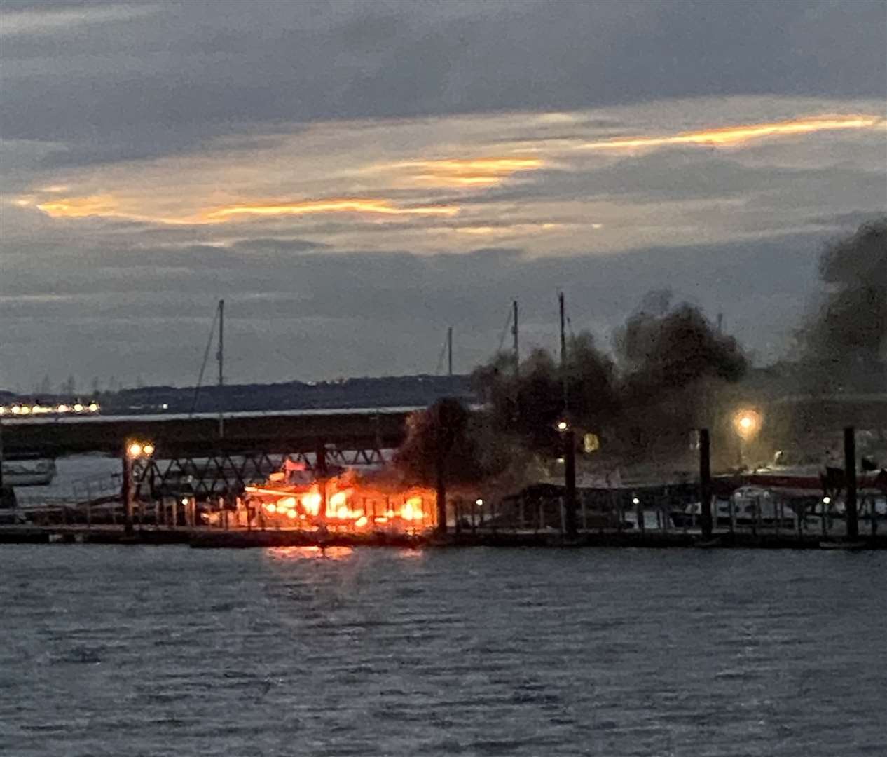 The boat was engulfed in flames after it exploded at Queenborough marina. Picture: Simon Fowle