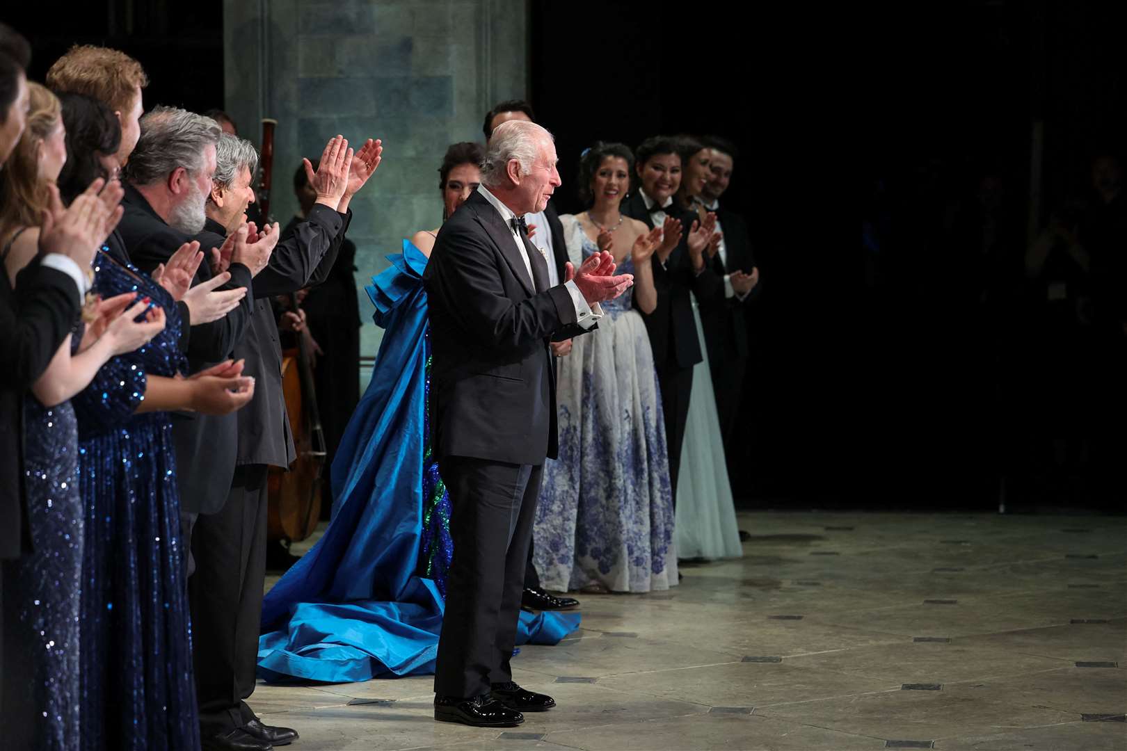 The King applauds alongside the cast (Isabel Infantes/PA)