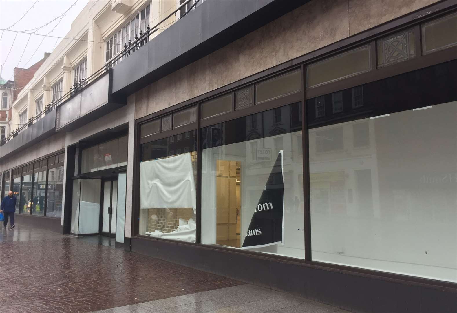 A sorry state - fallen down signs at Folkestone's Debenhams are to be replaced with a new display