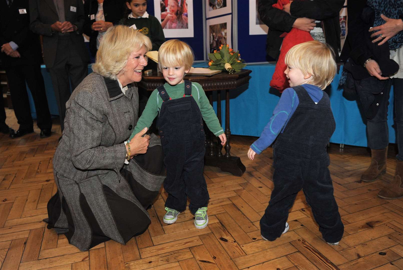 Camilla is greeted by her grandchildren, twins Gus and Louis Lopes, in 2012 (Tim Ireland/PA)