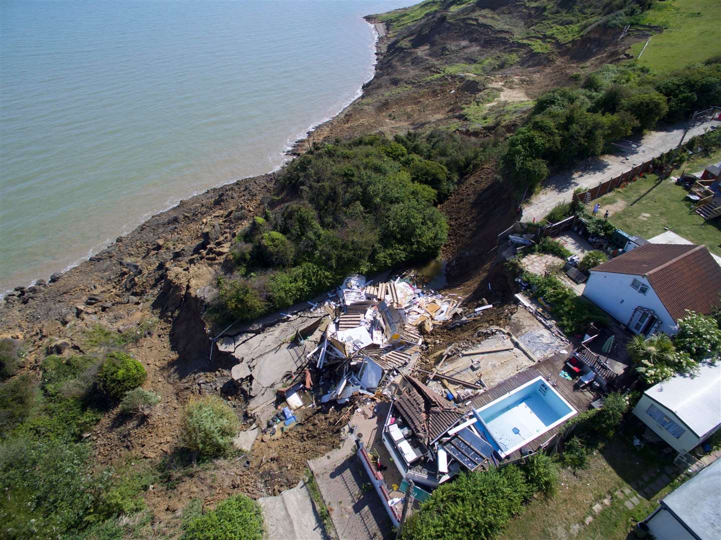 The house in Surf Crescent, Eastchurch, in June after the cliff collapse. Picture: RLH Media
