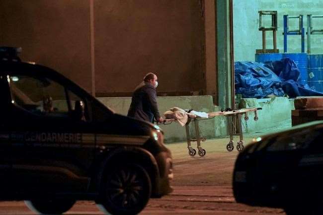 A man wheels a gurney into a warehouse in the Port of Calais, France. Picture: PA