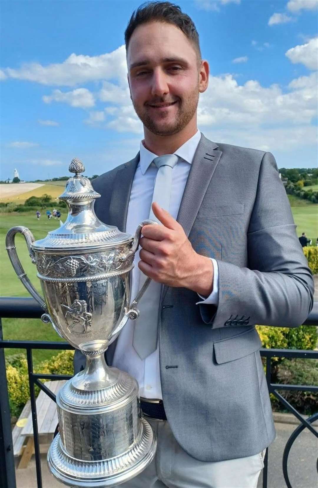 Canterbury Golf Club's Dan Cooke with the Invicta Challenge Cup