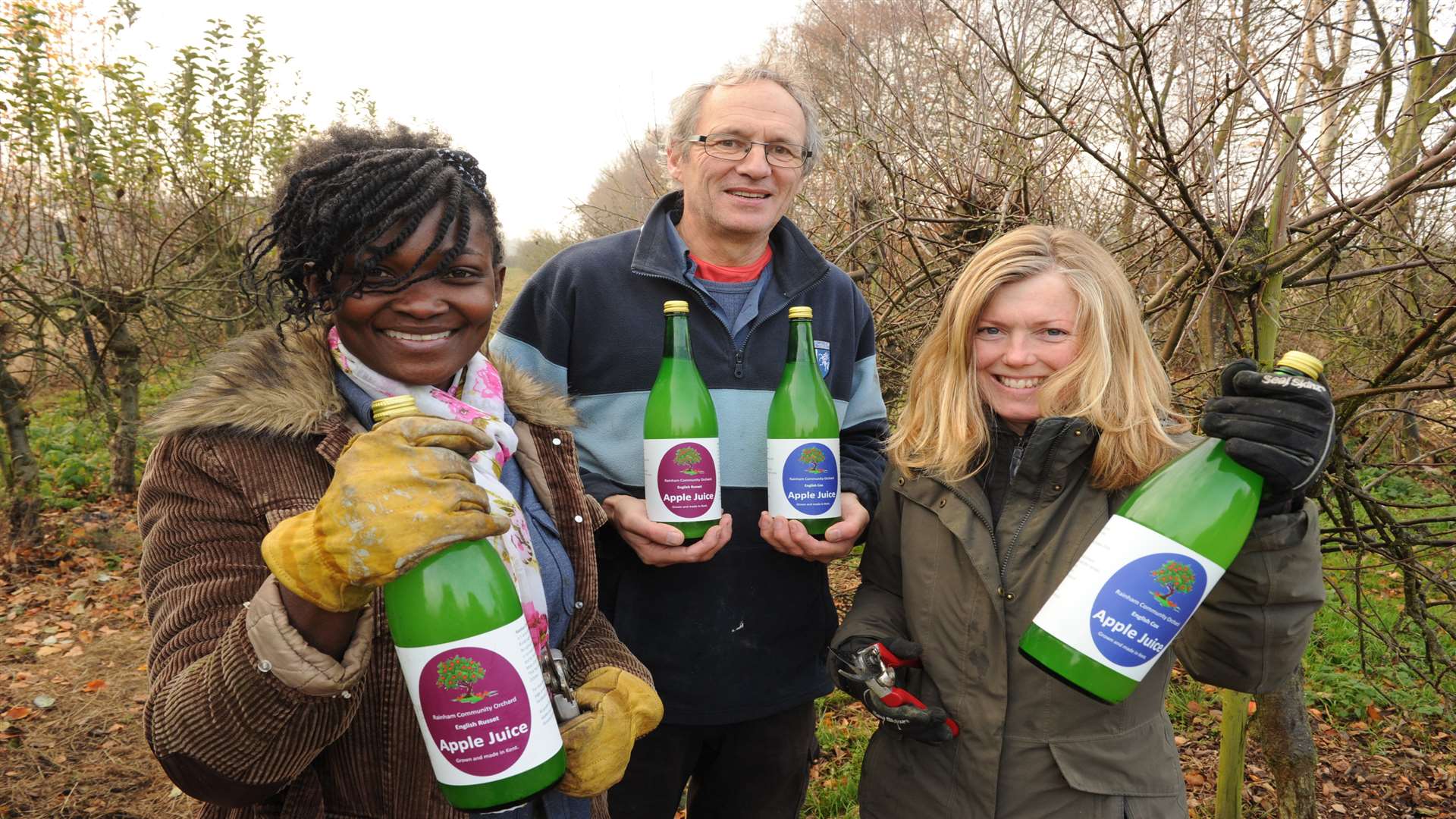 Volunteers Kerry Edy, Jo Elsmore and Rachel Ford with the apple juice