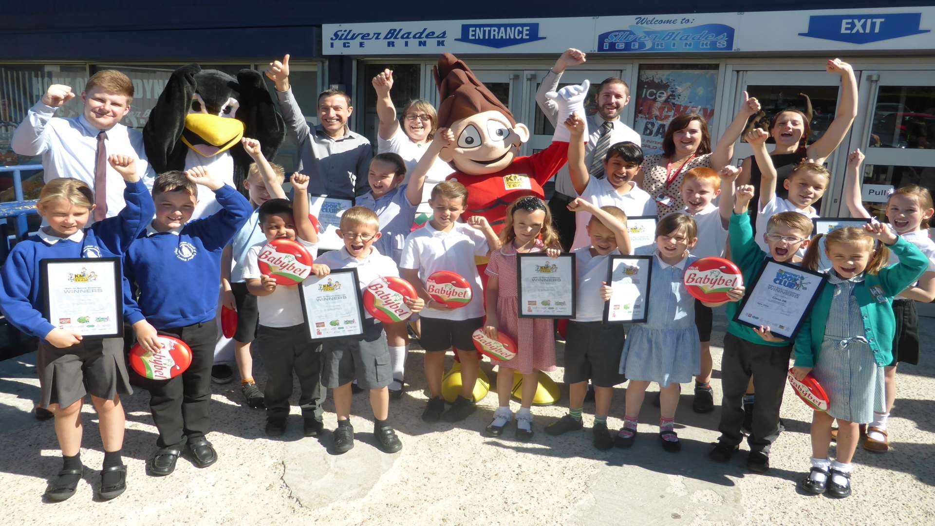 Winners of the KM Walk to School and Buster's Book Club double summer challenge joined by mascots and supporters KCC, Bel UK, Medway Council, and 3R's at Silver Blades ice rink.