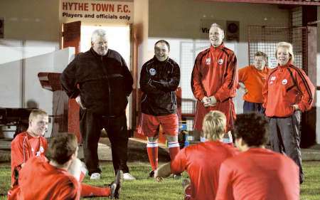 Hythe's players and coaching staff taker a break at training ahead of the FA Cup tie against Hereford