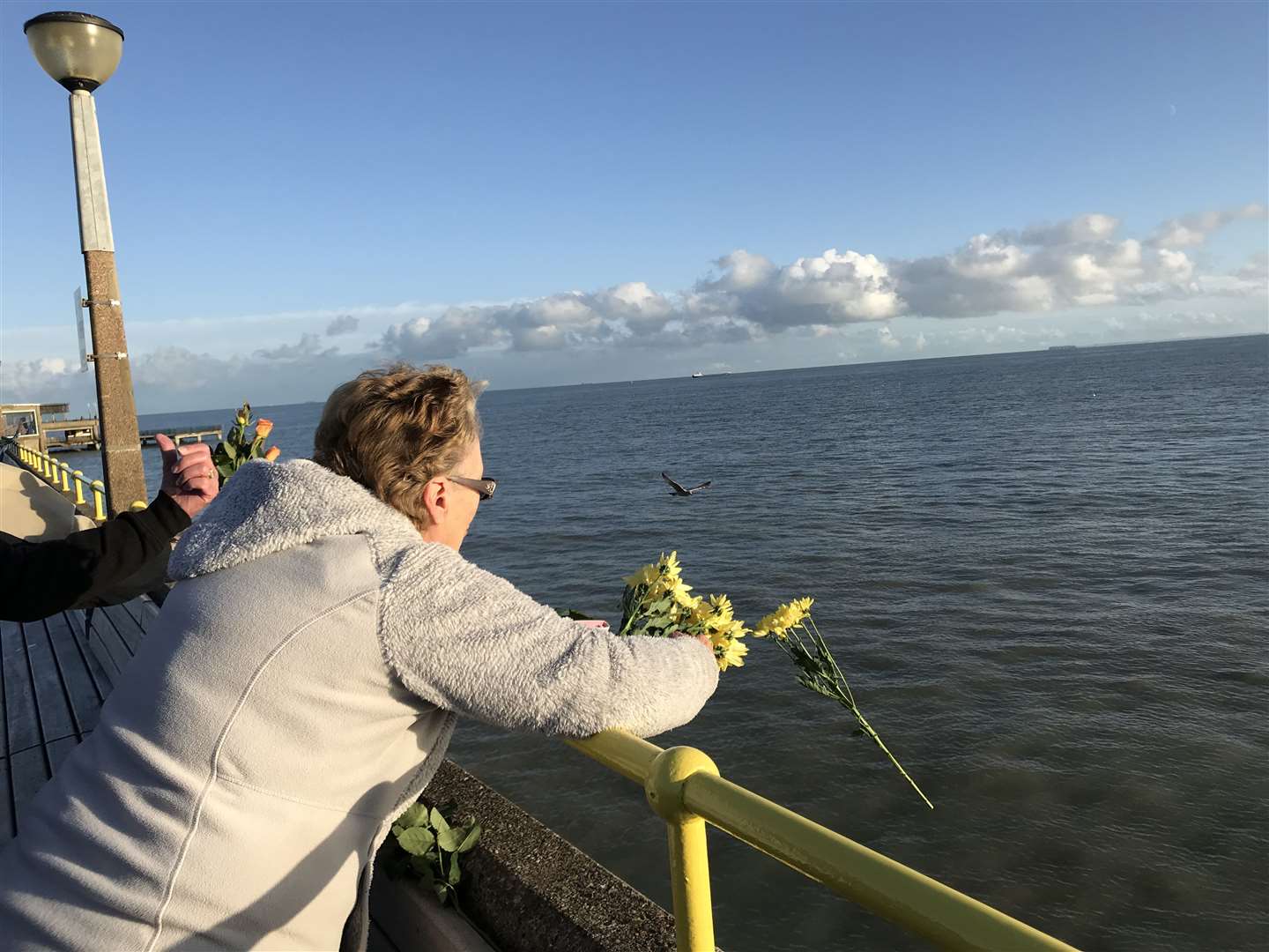 Friends and family of Debbie Griggs threw flowers in to the sea at Deal in her memory