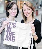 Louise Whiffin and Danea Charleston in Fremlin Walk with the new phold shopping bag