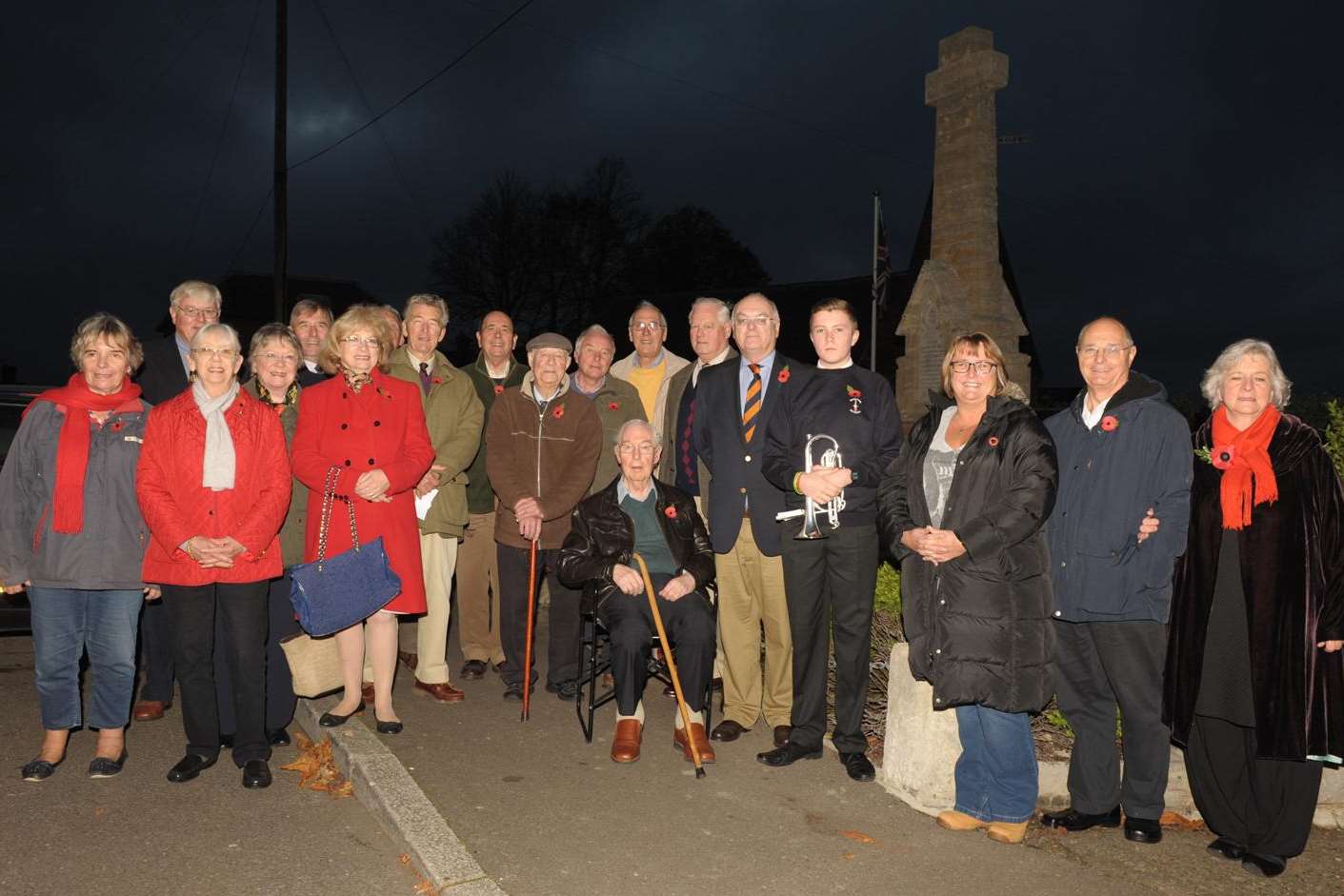 Villagers gather at the War Memorial