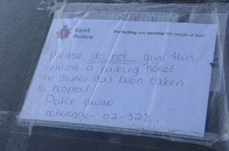 The police note on the car outside Sittingbourne Police Station to say the owner has been taken to hospital