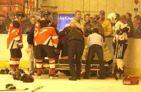 CONCERN: Scott Carter is stretchered off the rink after the clash with Invicta's Elliott Andrews. Picture: BARRY CRAYFORD