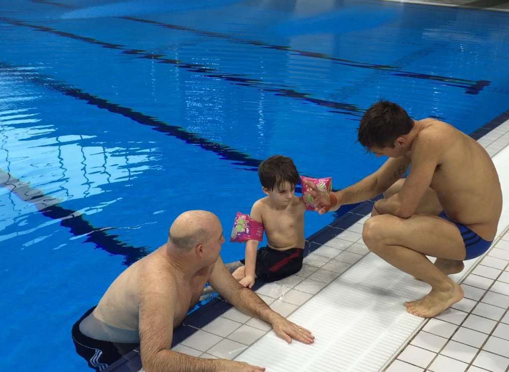 Samuel Bourdillon with dad Paul and Tom Daley