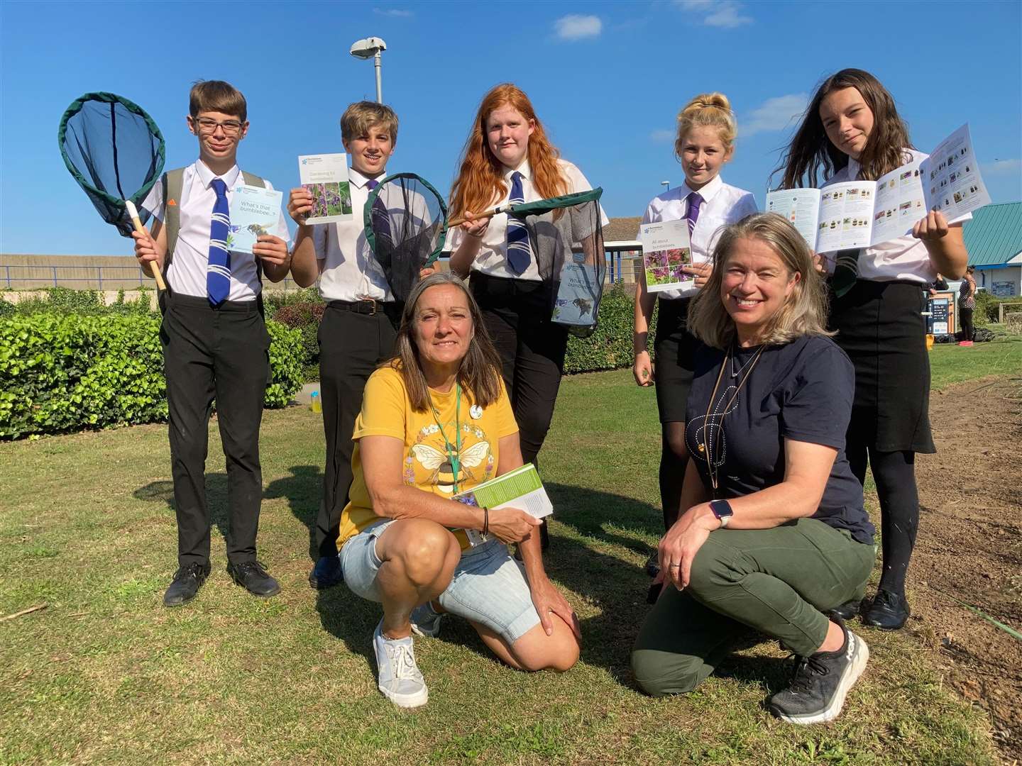 Pupils from the Oasis Academy went on a bee hunt at Beachfields, Sheerness, as part of the Great Big Green Week with Emma Lansdell, left, of the Bumblebee Conservation Trust and Ali Corbel of Swale council