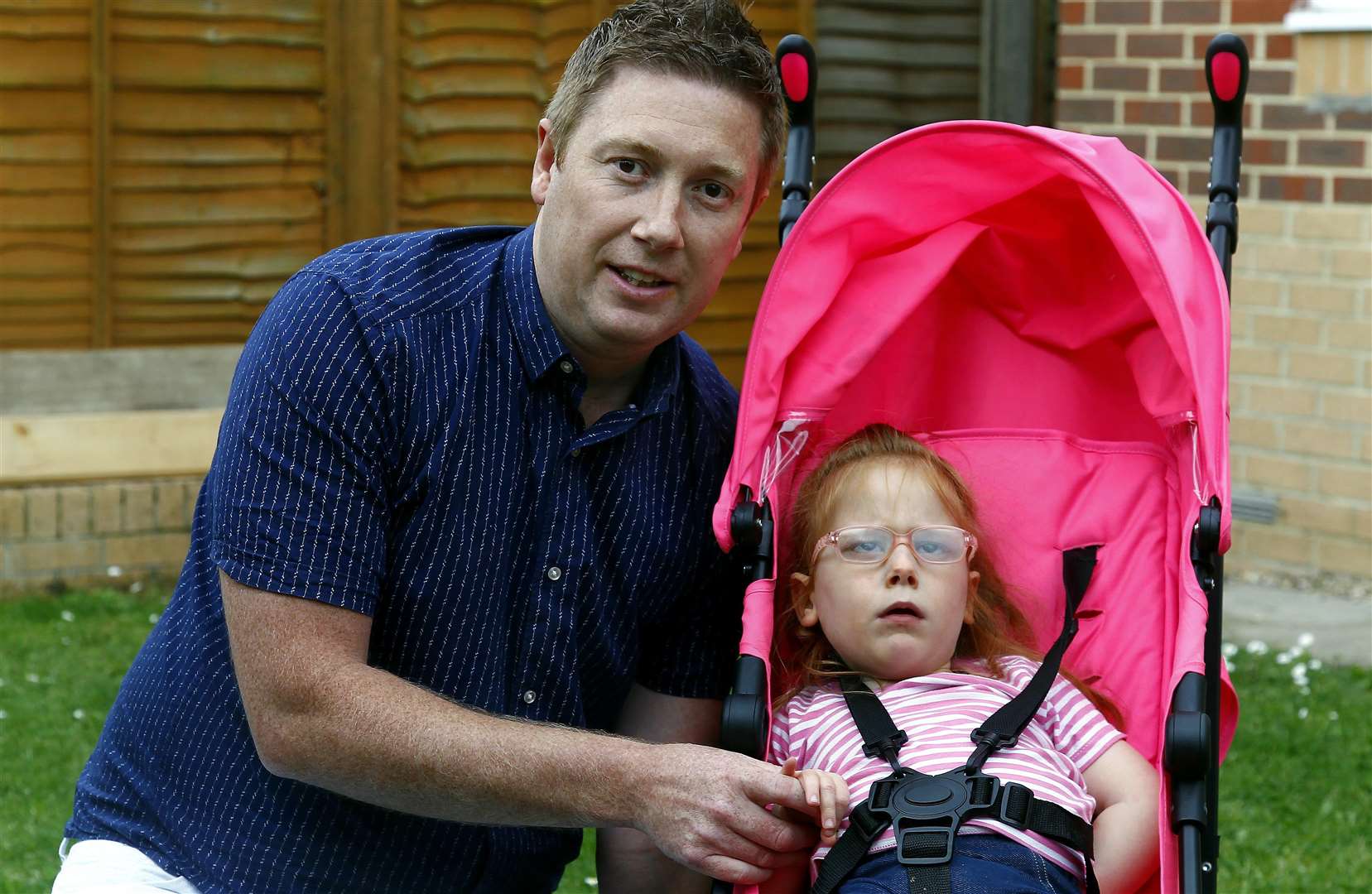 Mia-May McDoland 3, no-option but to use an unfit chair after Millbrook messed up the order for her specialist chair. Pictured at home in Gainsborough Drive, Maidstone with dad Nick.Picture: Sean Aidan*** mum Jo was not there*** (2188396)