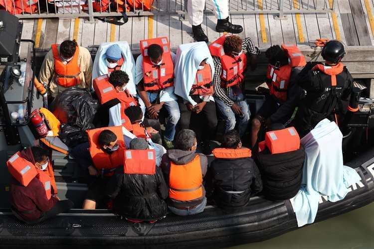 A group of people waiting on a Border Force rib in September. Picture: Gareth Fuller/PA