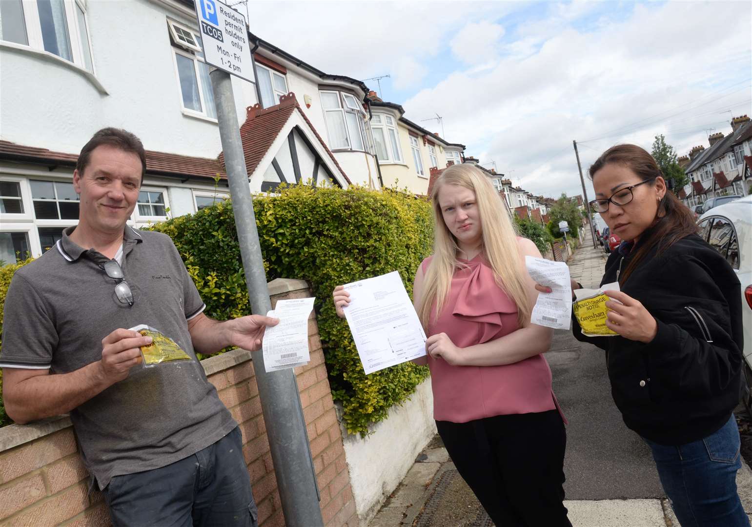 Mark Bruce, Sarah Cox and Somphon Bates are angry about new parking restrictions