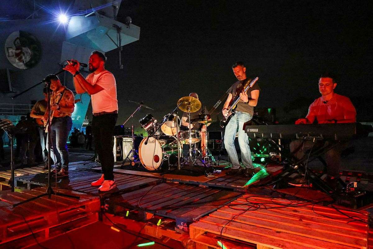 HMS Queen Elizabeth crew enjoy one of the ship's company's bands playing during some downtime docked at Yokosuka in Japan. Picture: MoD