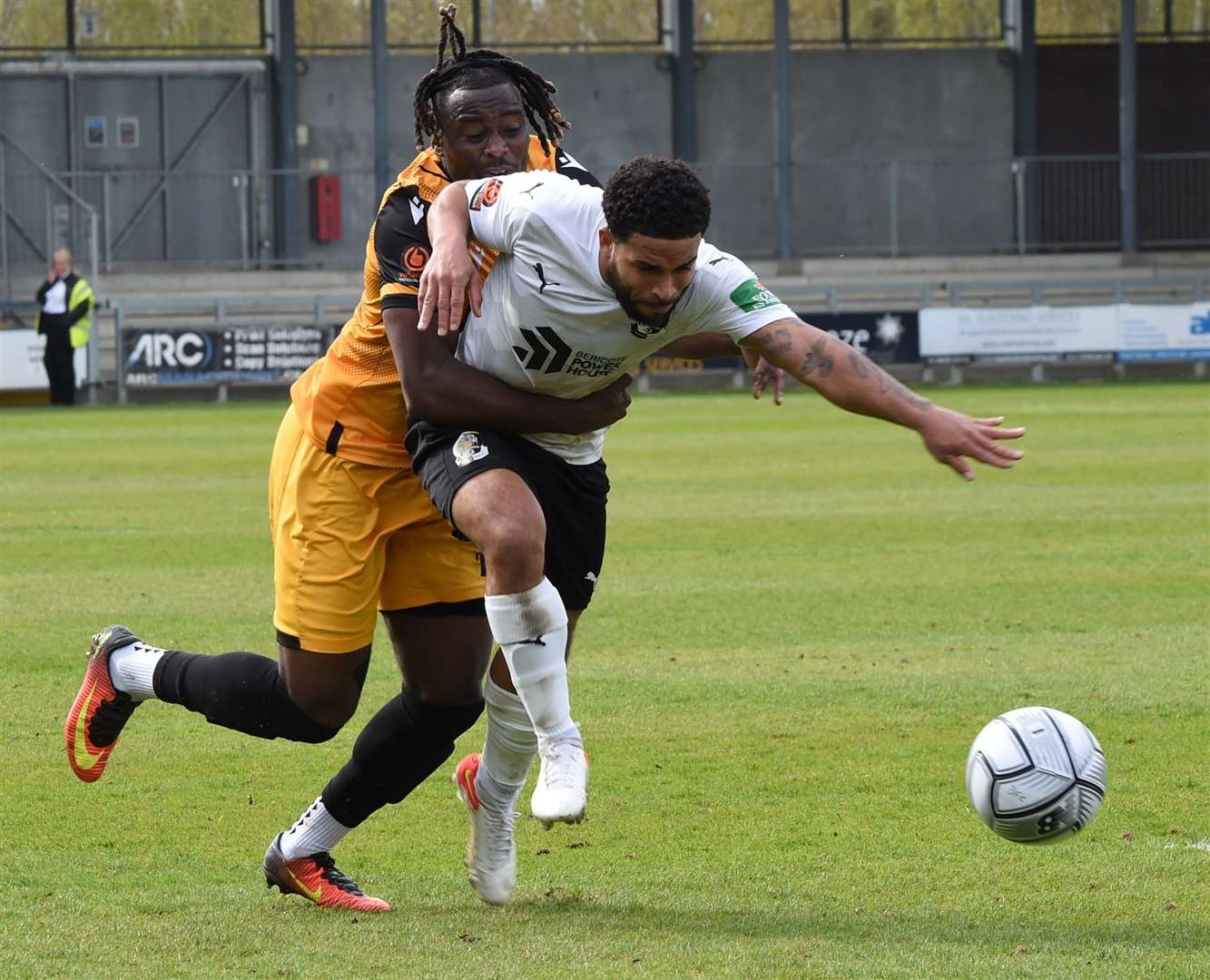 Datford full-back Jernade Meade tries to escape the clutches of Maidstone's Christie Pattisson on Easter Monday Picture: Steve Terrell