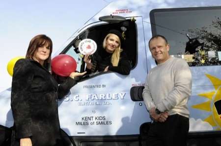 Actress and model Nancy Sorrell with minibus sponsor Steve Farley and Liz Baxter of Kent Kids Miles of Smiles