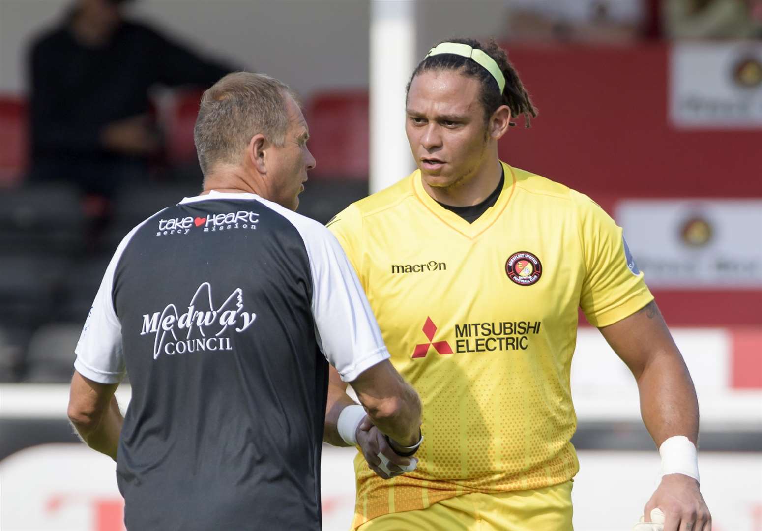 Nathan Ashmore shakes hands with Gills boss Steve Lovell in pre-season Picture: Andy Payton