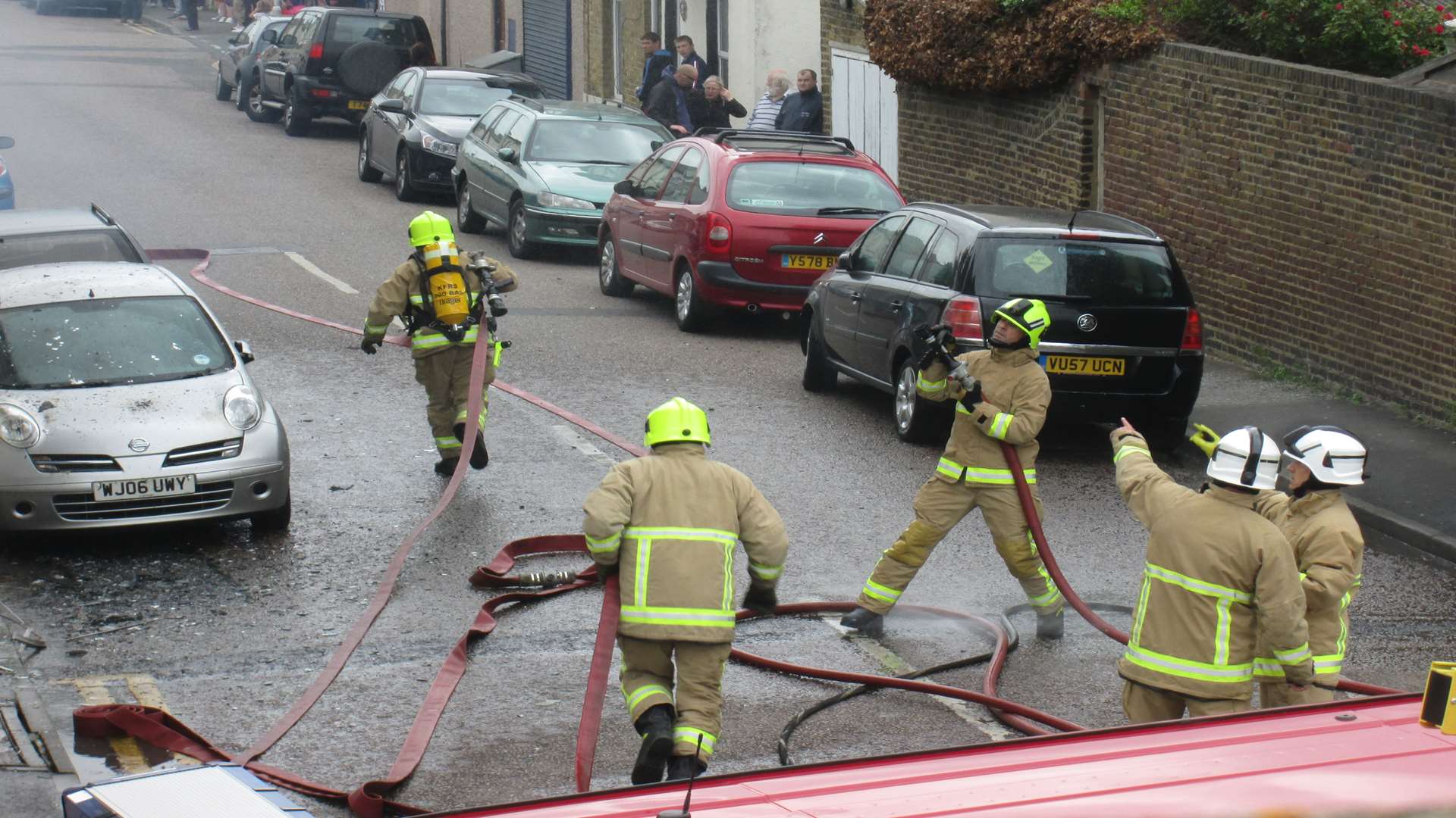 Firefighters scramble at the scene of the fire in Sheerness