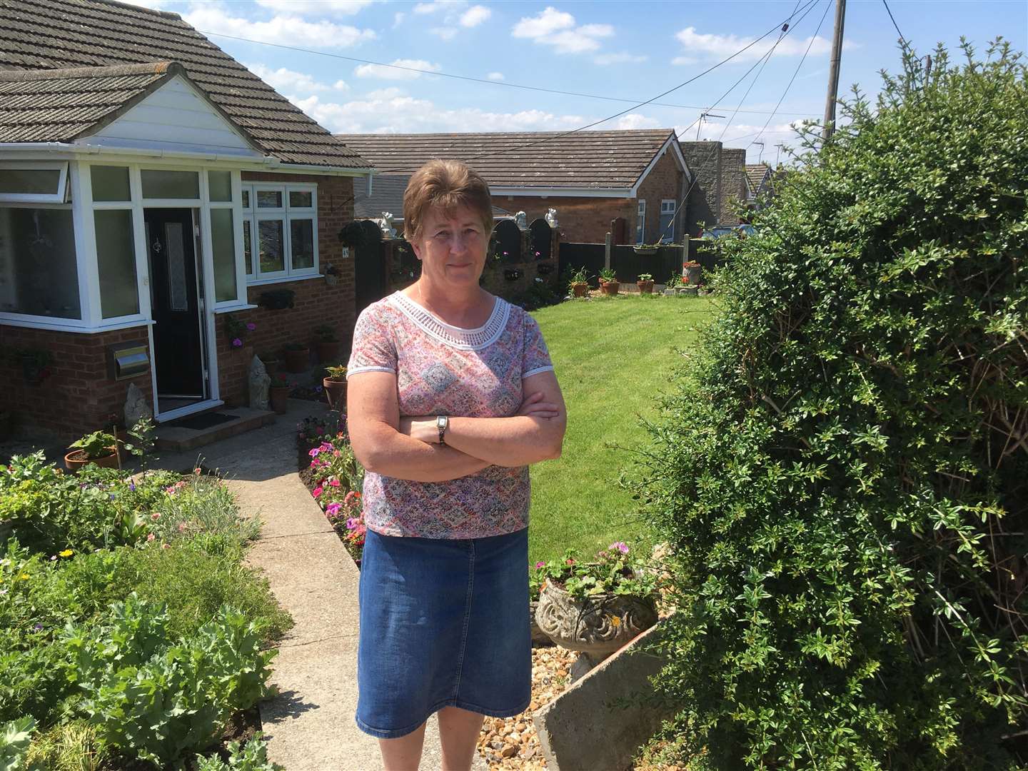 Neighbour Julie Clarke in the front garden of her bungalow in Nelson Avenue, Minster. She fears cars will crash into her home if developers are allowed to demolish the bungalow opposite her to create an entrance to a new housing estate