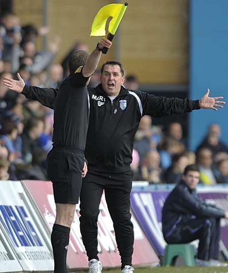 Gillingham manager Martin Allen questions this decision as the linesman flags for an infringement