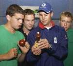 Geraint Jones shows the replica Ashes urn to intrigued young cricketers. Picture: CHRIS DAVEY