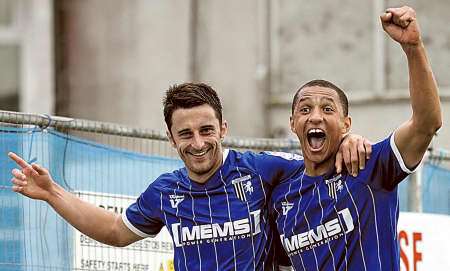 Chris Whelpdale celebrates after scoring Gillingham's fifth goal with Lewis Montrose