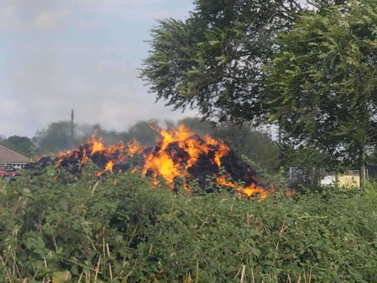This picture, taken yesterday, shows about 100 hay bales ablaze next to the junction of the A251 and Shottenden Road