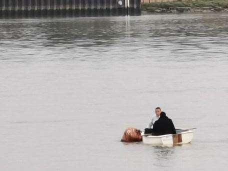 The boat with two people on board stranded in the River Medway