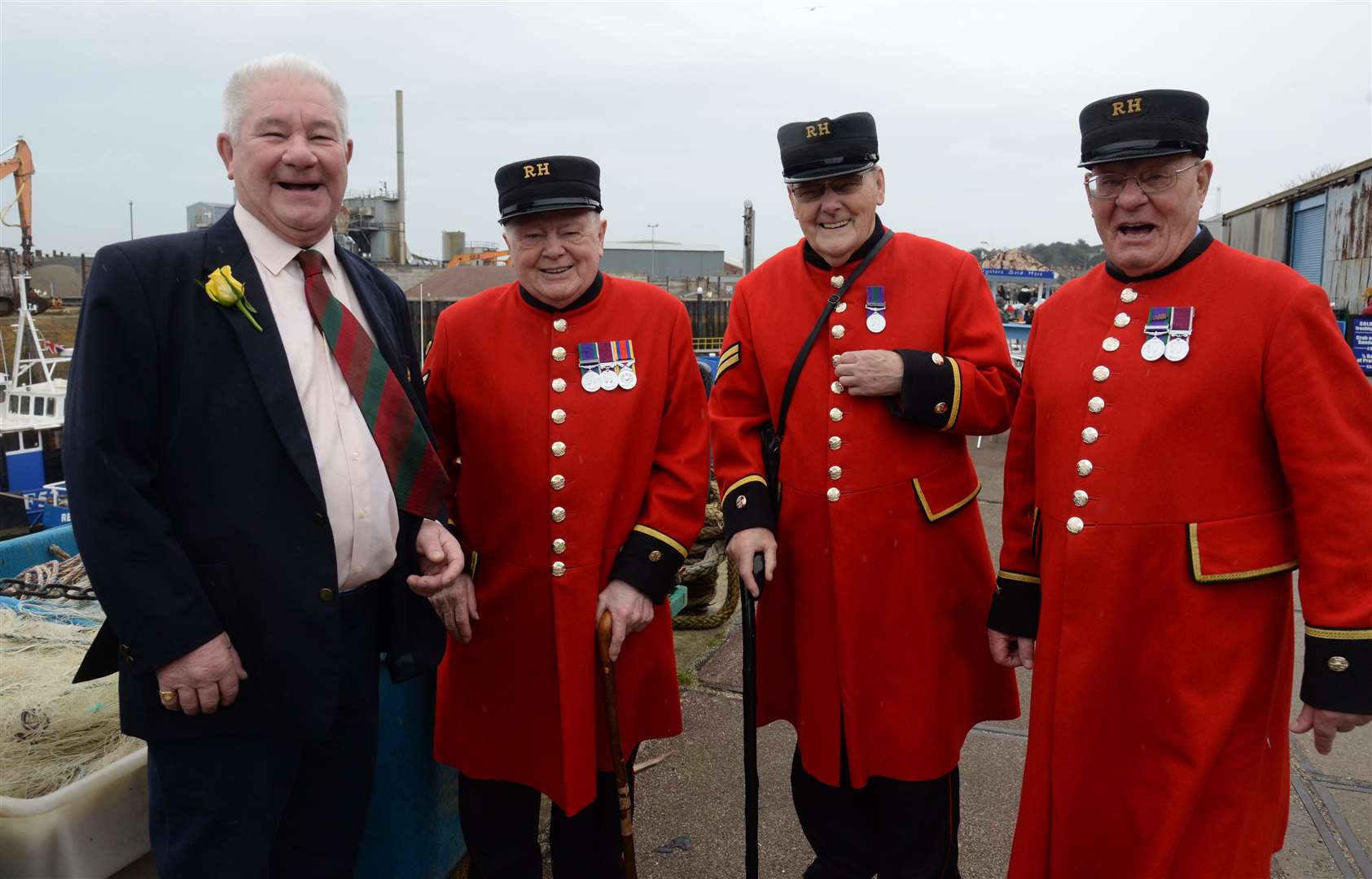 Peter Bennett with Chelsea Pensioners Fred Bolwell, John Walker and Don Crassweller by the Crab and Winkle Restaurant in Whitstable Harbour. Picture: Chris Davey