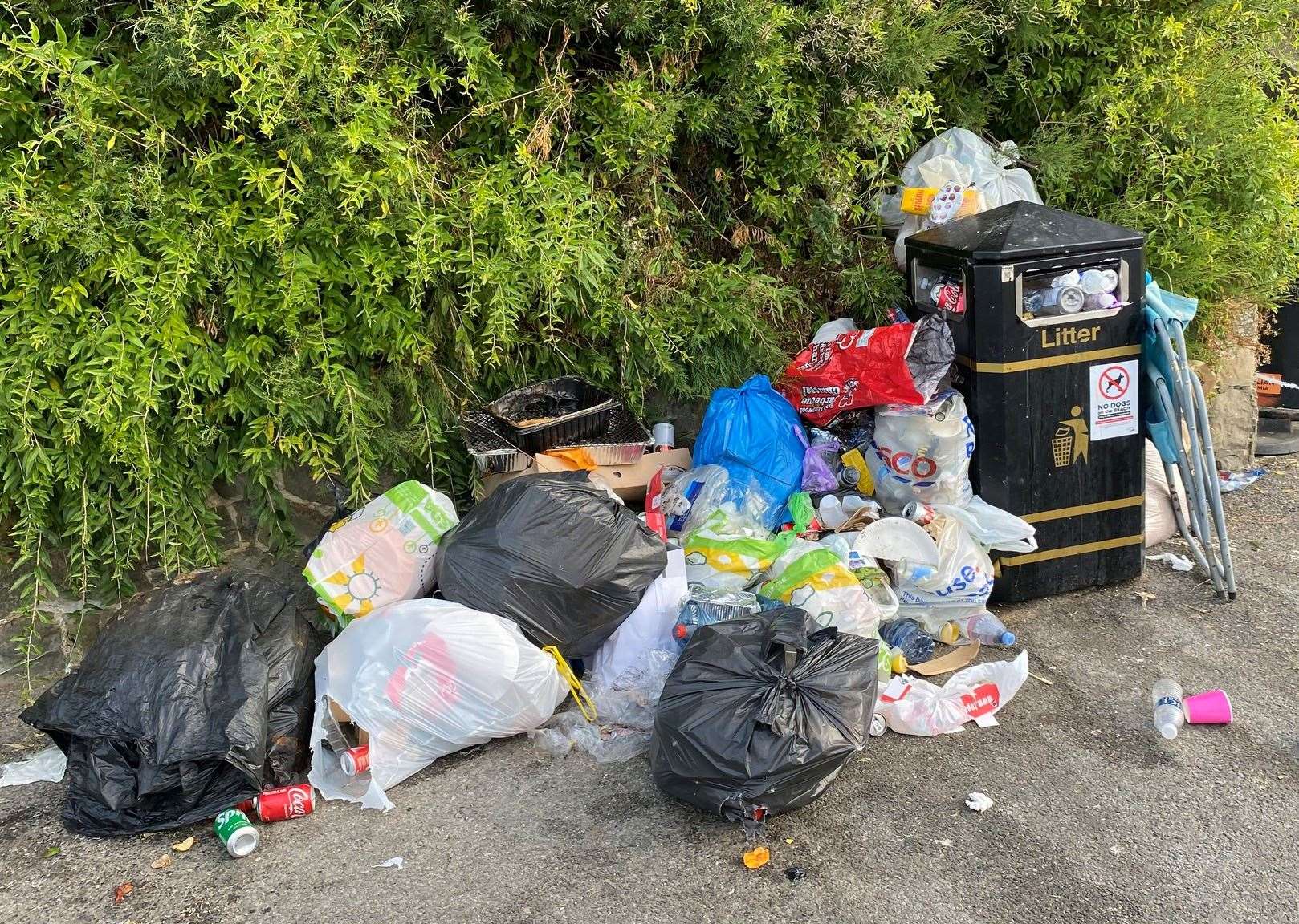 Huge amounts of litter around an overflowing bin seen in Folkestone last month. Picture: Stephen West