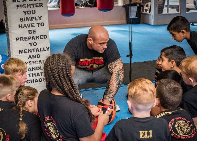 Matt Simms with a kids boxing class Picture: Jon Snapaway