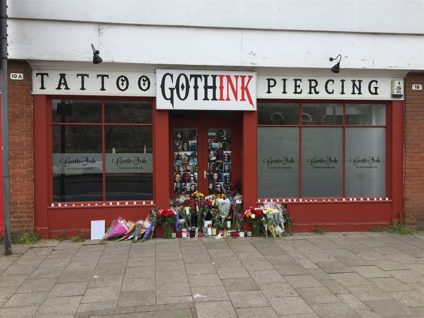 Tributes to Ramona Stoia, 35, outside the GothInk tattoo parlour in Canterbury