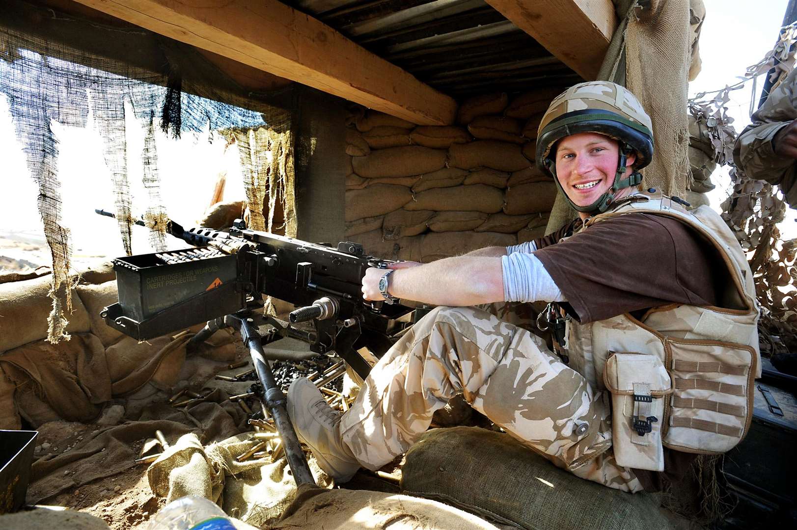 Harry mans a 50mm machine gun at the observation post in Helmand Province on his first tour of duty (John Stillwell/PA)