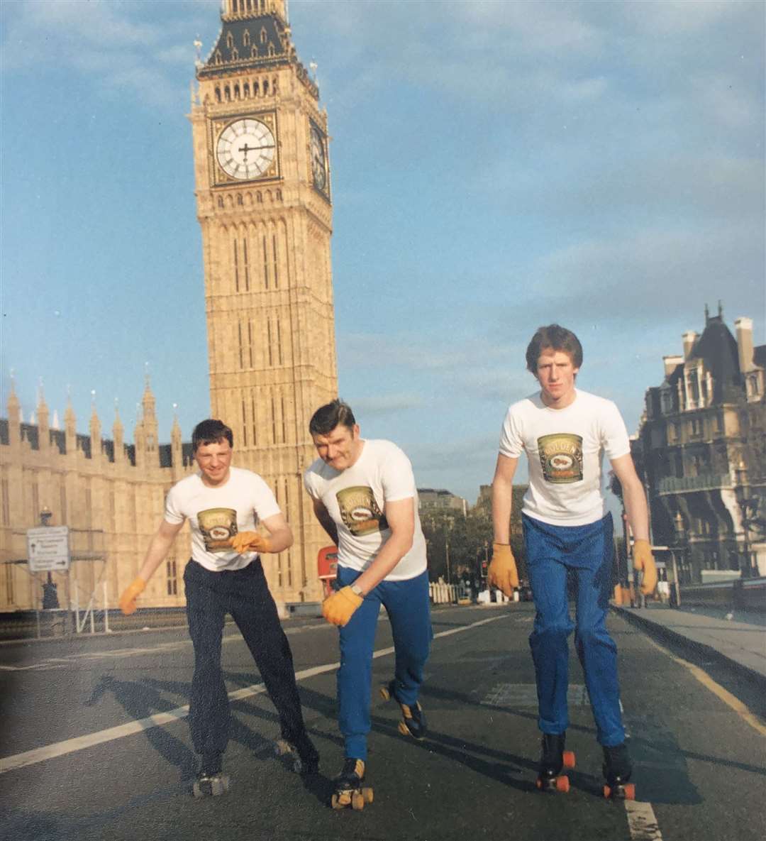 David (middle) roller-skating to Brighton in one of his other challenges