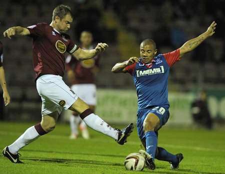 Deon Burton stretches for the ball against Northampton