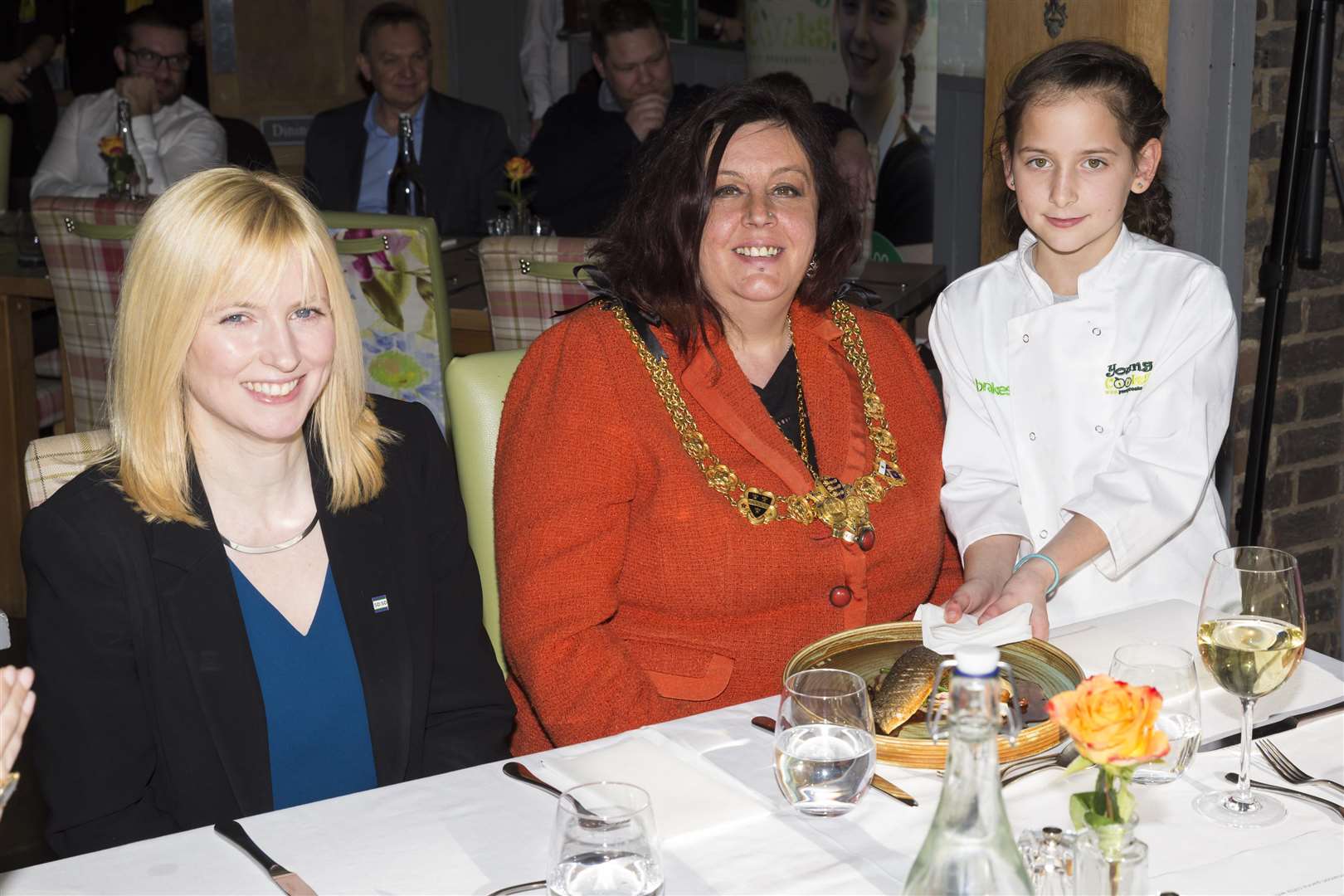 Young Cooks 2018 champion Boglar of St Nicholas Primary School serves her prize-winning food to the Mayor of Dover Cllr Susan Jones, sitting with Canterbury MP Rosie Duffield.