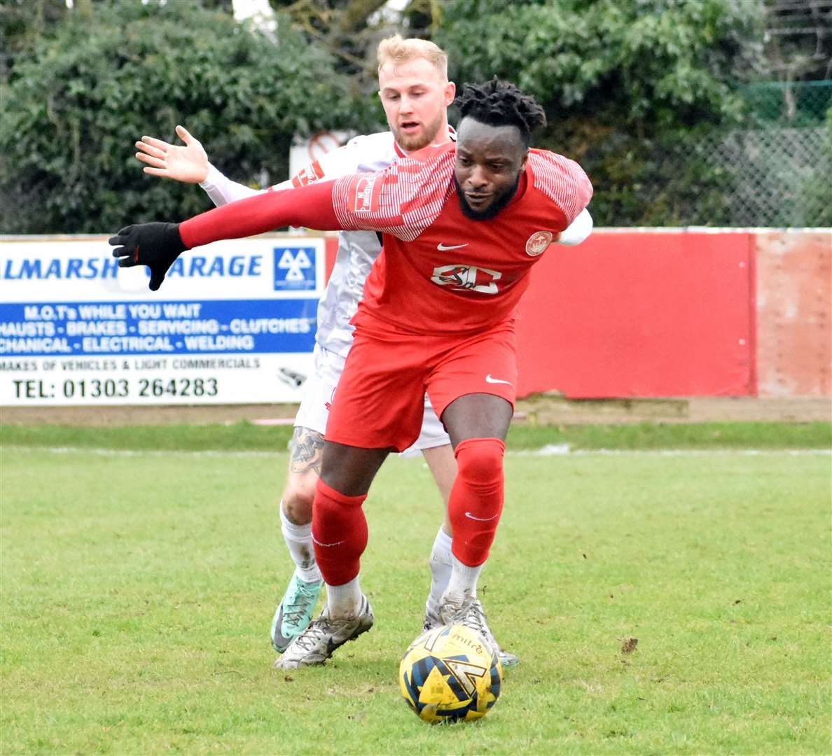 Hythe's Aaron Barnes keeps Ramsgate's Alfie Paxman at bay on Saturday Picture: Randolph File