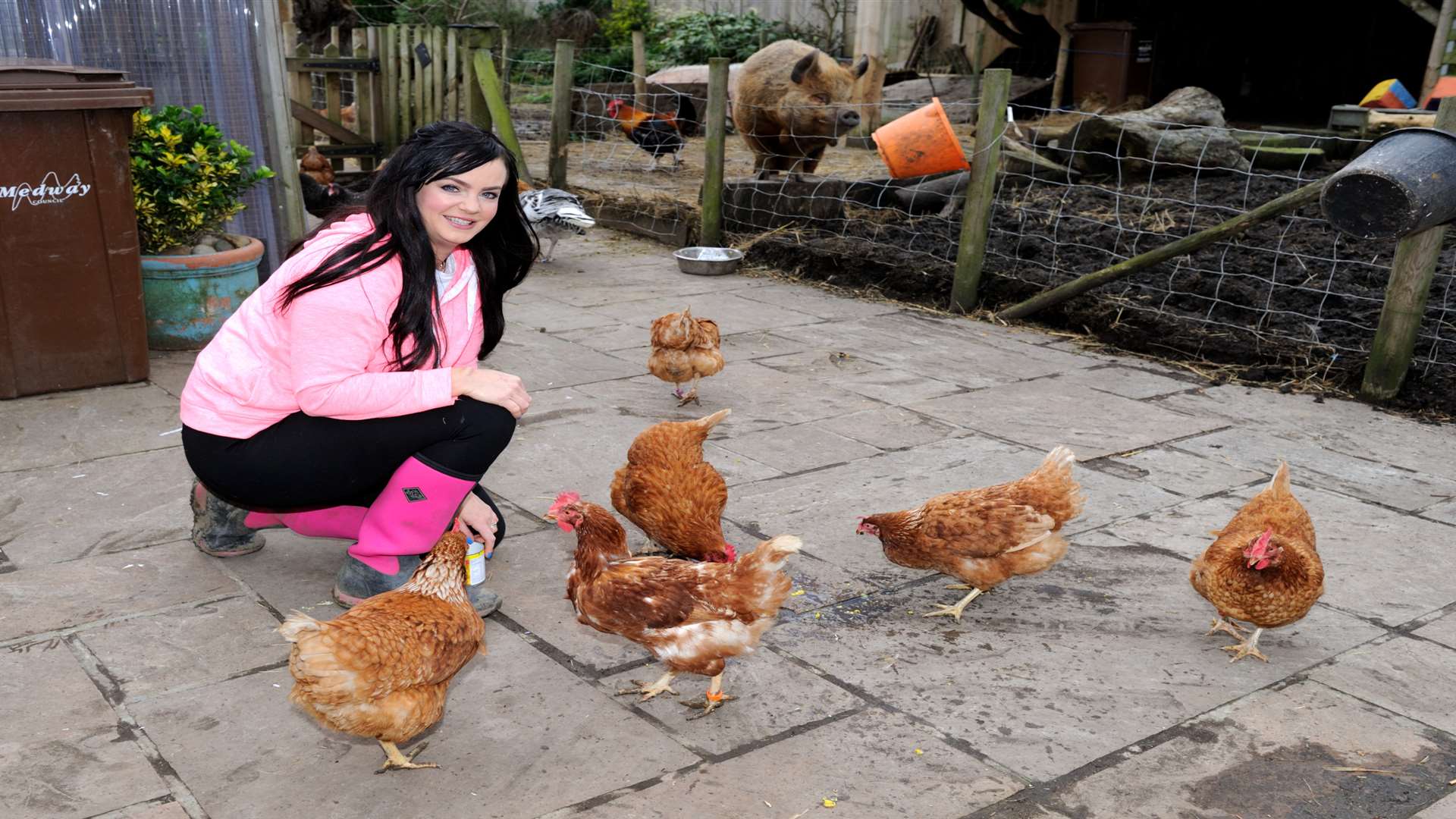 Amey Evans with ex battery hens she helps to rehome