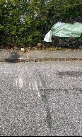Tyres marks can be seen on the road near the centre building