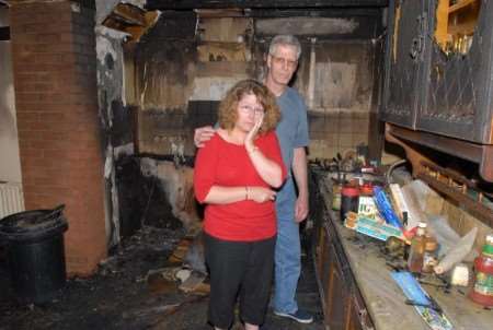David and Jackie Parkes, of Nelson Avenue, Mnster, in their fire damaged kitchen