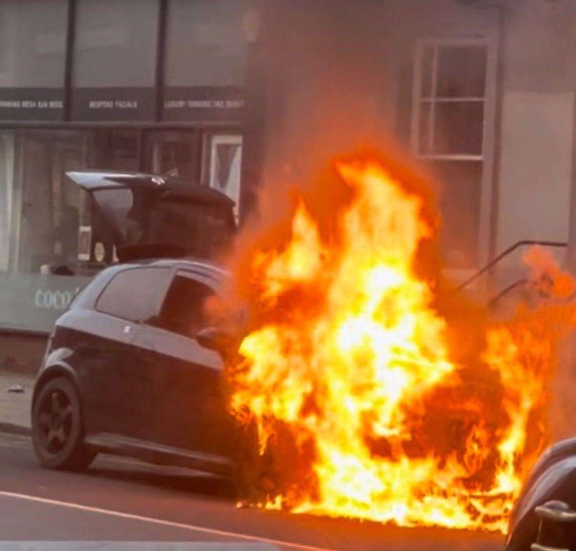 A car burst into flames in Herne Bay's High Street. Pic: Paul Surgison