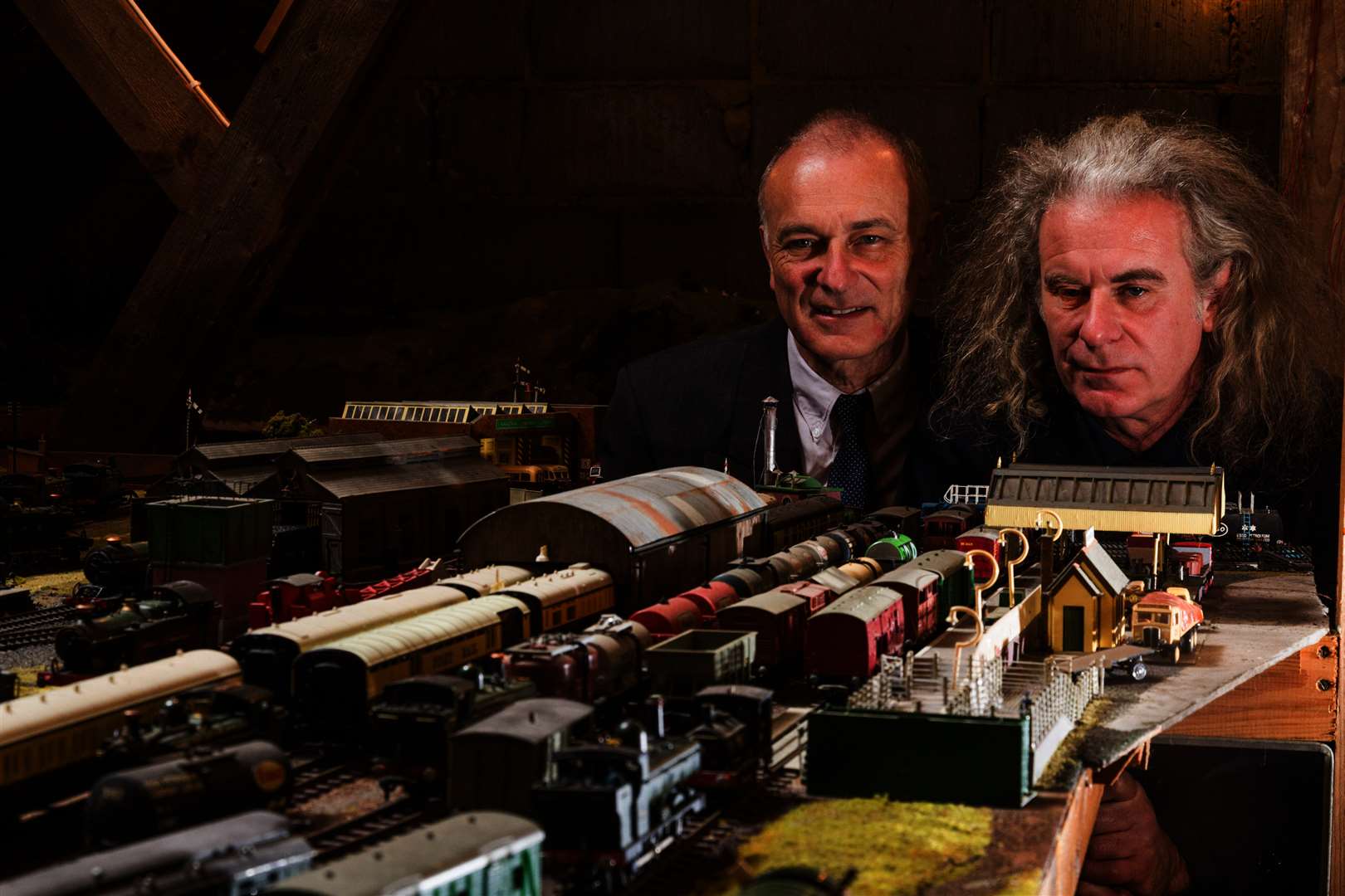Sons Paul and Simon with the impressive model set built by their father. Picture: SWNS