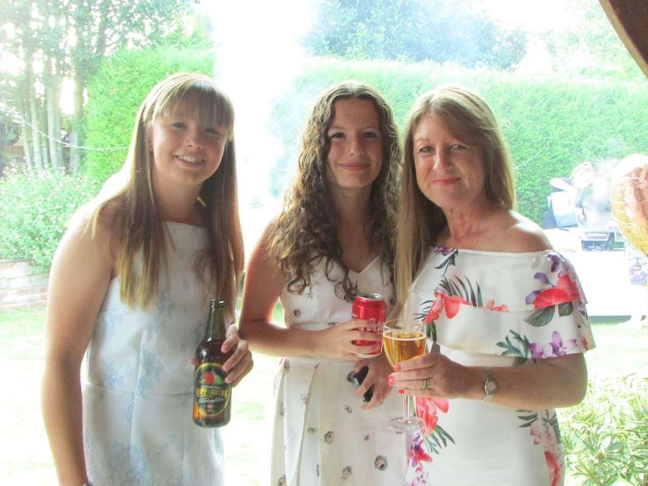 Nicky Clifford right with her two daughters, Megan, 22, on the left, and Ella, 18, in the centre, both born since her transplant