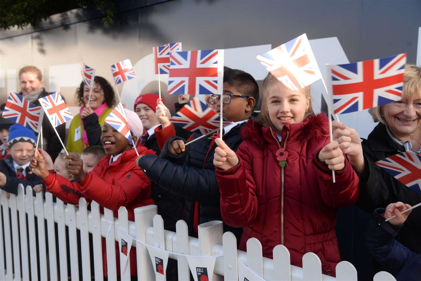 Children from Green Street Green Primary School await the arrival of The Queen at the Royal British Legion Industries, Aylesford on Wednesday. Picture: Chris Davey. (21031414)