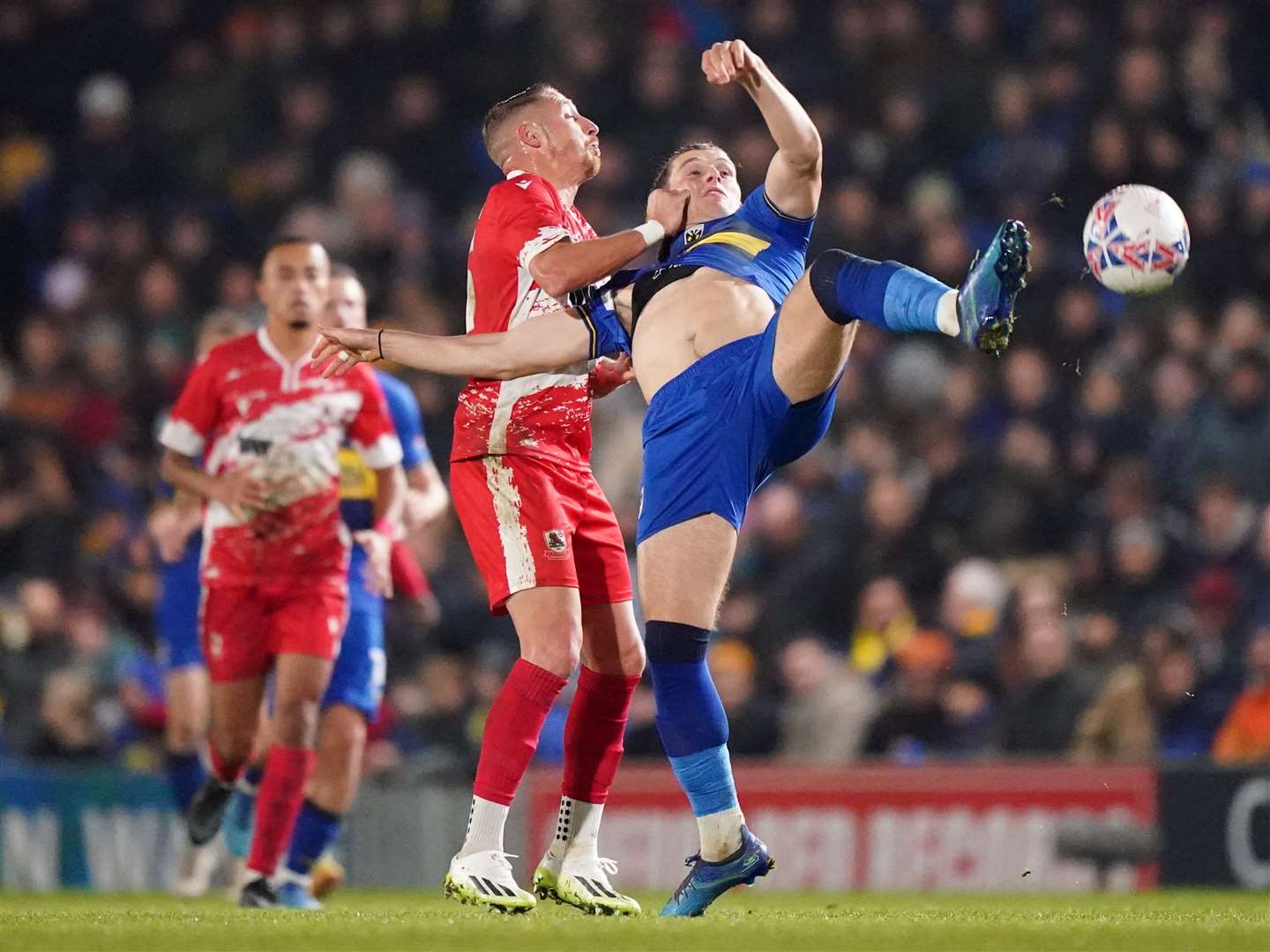 Ramsgate’s Lee Martin gets to grips with AFC Wimbledon's Josh Davison at Plough Lane on Monday night Picture: PA Images