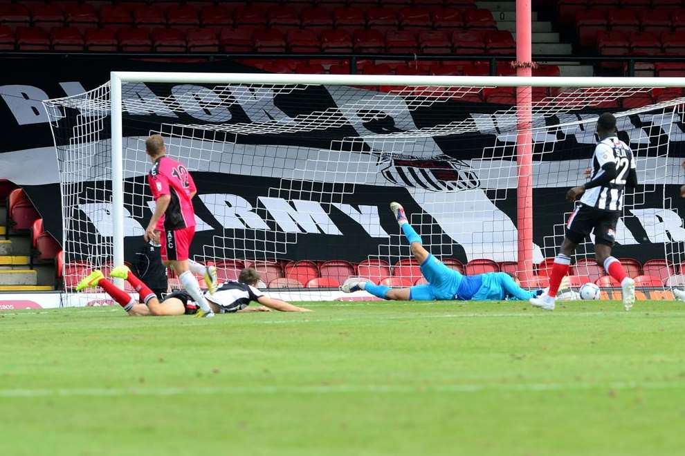 Matt Lock scores Dover's equaliser in the 1-1 draw at Grimsby Town last Saturday. Photo: Abby Ruston